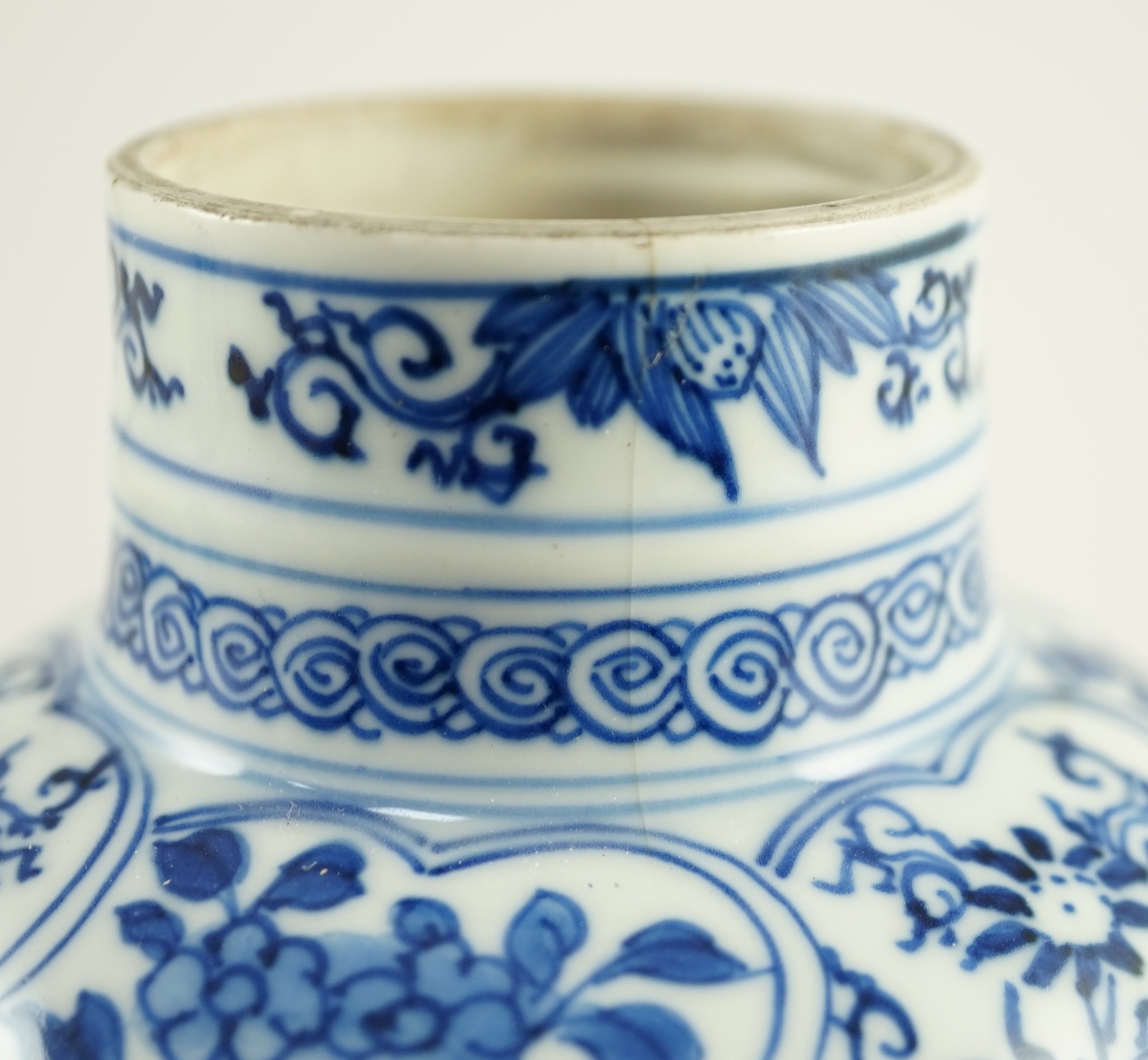 A Chinese blue and white vase, Kangxi period, 21cm high, hairline crack to neck